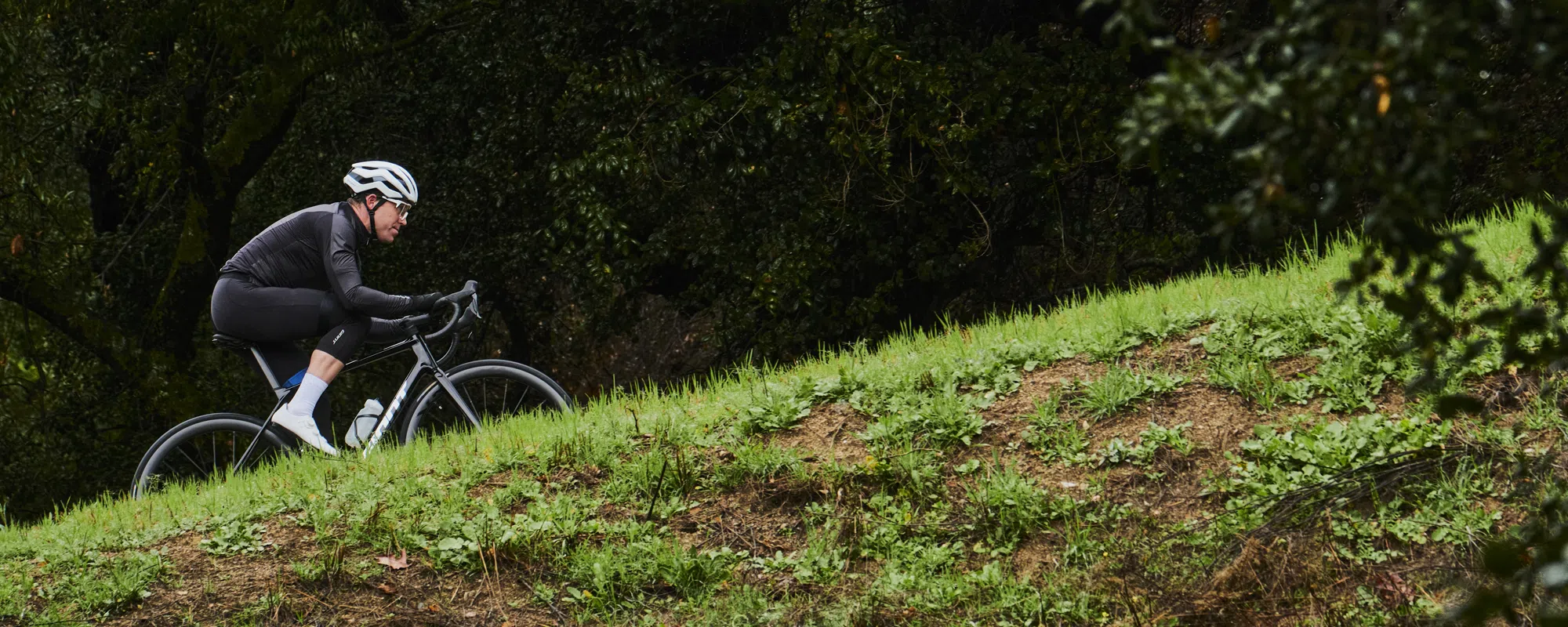 a Giant road bike is ridden uphill