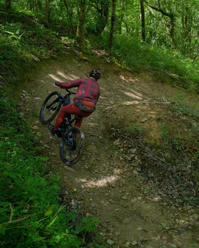 Specialized Levo 4 Comp Alloy ridden around a berm