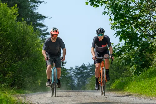 cyclist riding gravel in the summer