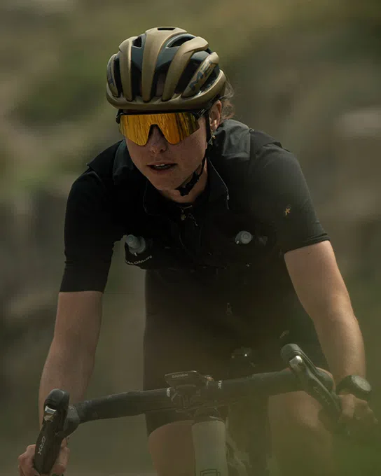 woman gravel riding in a met wander helmet