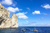 two boats next to an arch on the tyrrhenian sea