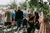 wedding guests standing to watch the wedding ceremony 