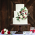 Layered white wedding cake with poppies and roses