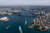 sky scraper with a bridge in sydney overseeing the sydney opera house