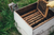 bee keeper emptying a bee hive case 