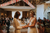 brides saying their vows to each other in a barn