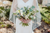 bride walking with her veil down and bouquet in hand 