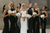 bride and bridesmaids wearing matching black dresses