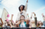 girl on boys shoulders at a festival