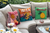 An outdoor seating with colourful cushions with embroidery