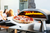 Making pizza in the pizza oven during the garden party with friends
