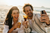 Couple enjoys drinks during their honeymoon