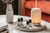 A NEOM diffuser placed on a table in the living room