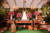 enchanted 5 tier wedding cake surrounded by wooden decor