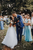 bride and groom celebrating with rose petal confetti 