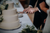 groom cutting the wedding cake