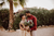 smiley newlyweds hema and ajai holding a bouquet of flowers