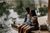 couple on wooden deck by the river 