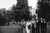 newlyweds and groomsmen in a black and white forest scene