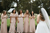 bride is walking towards happy bridesmaids