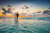 a happy bride and groom running across a beach during a sunset