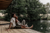 happy couple sitting on lake deck