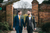 married couple walking down stone path hand in hand