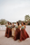 bride and her bridesmaids holding bouquets of flowers