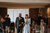 newlyweds walking down the aisle in a barn