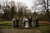 newlyweds and groomsmen in a forest