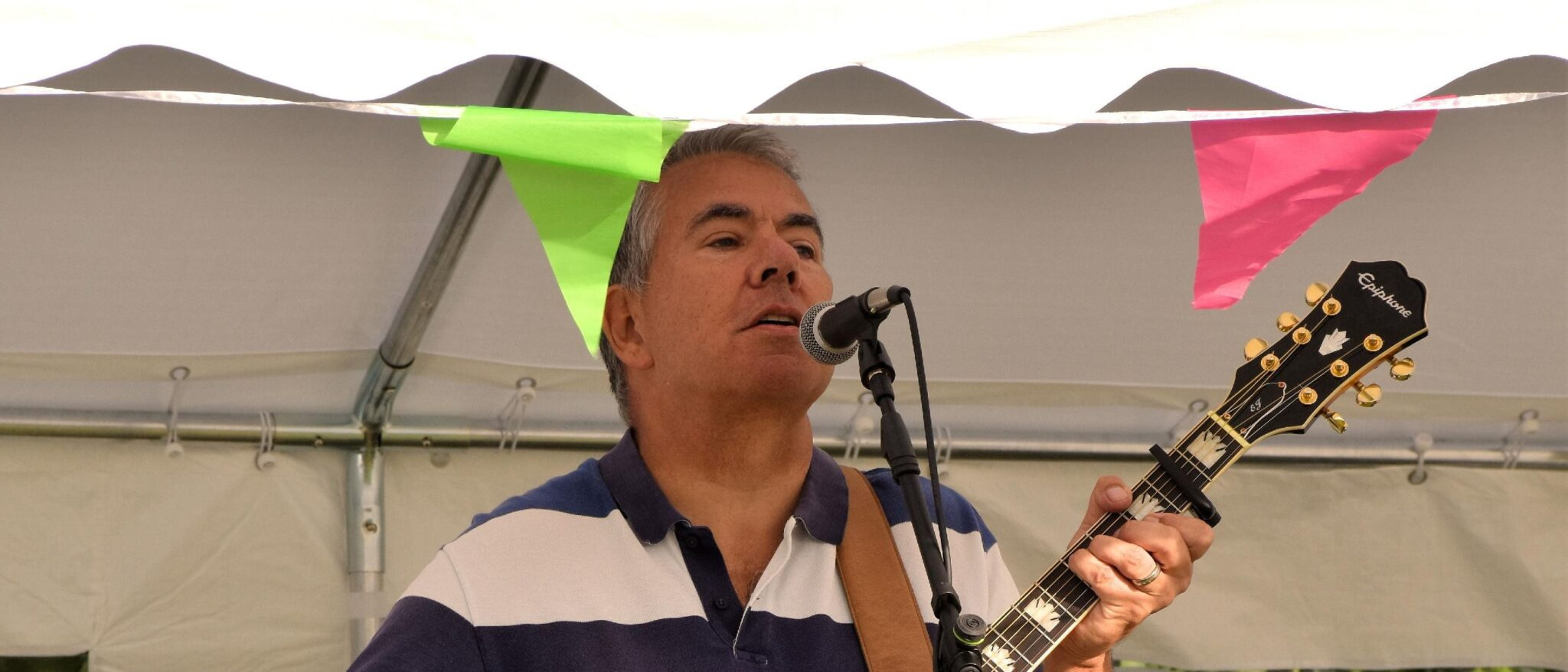 Nick Haynes who will be playing at TriFest, playing guitar and singing