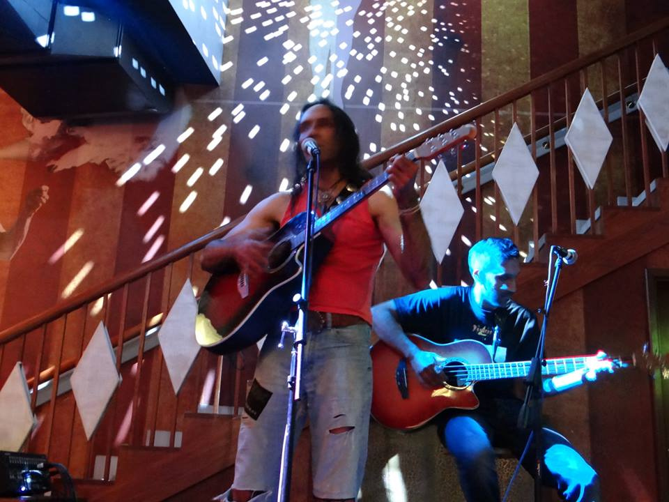 two band members Kinesis 4 playing live with guitars