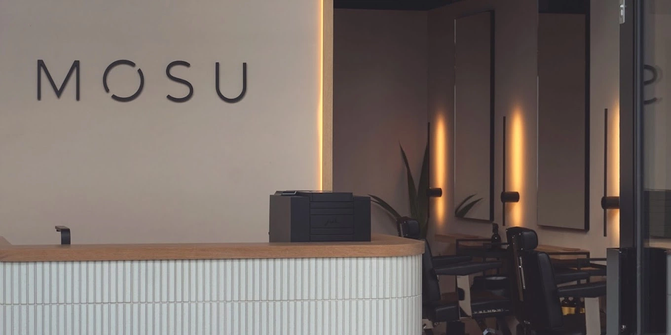 This image shows MOSU Hair Space front desk with ambient lighting