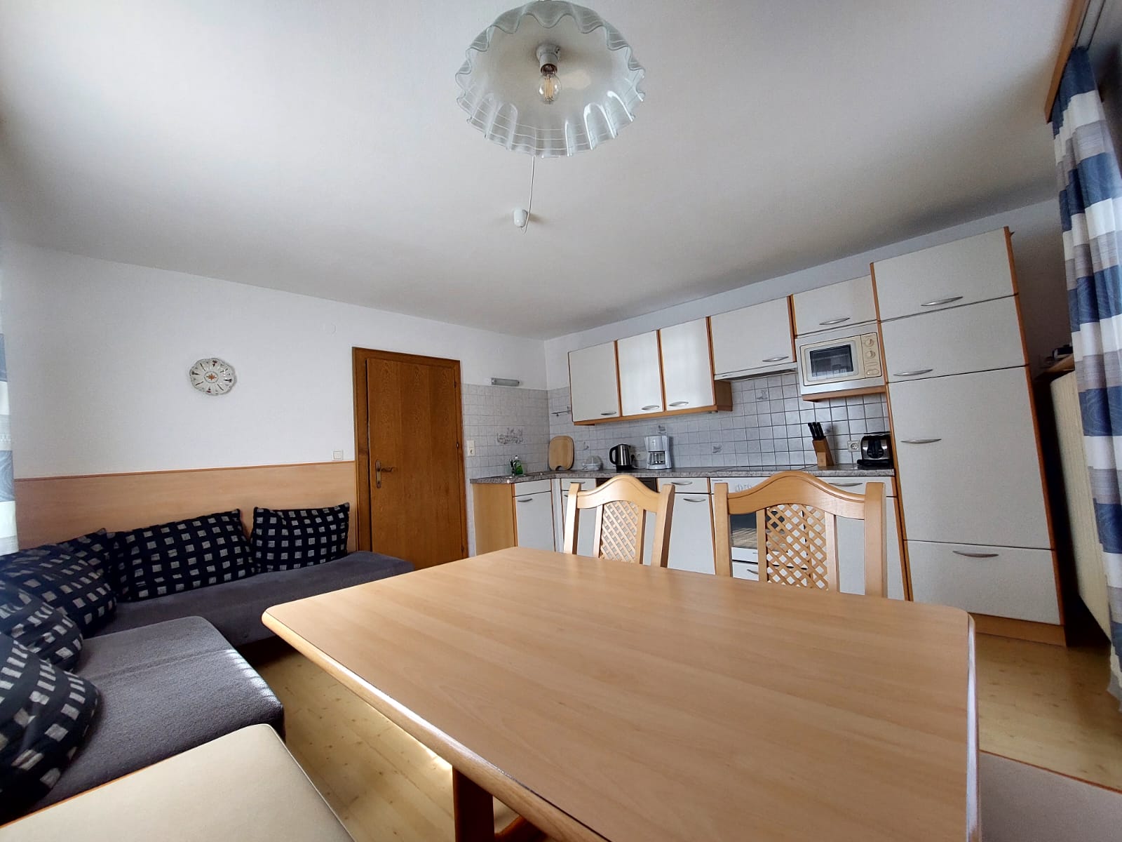 Kitchen with table and kitchen applicances