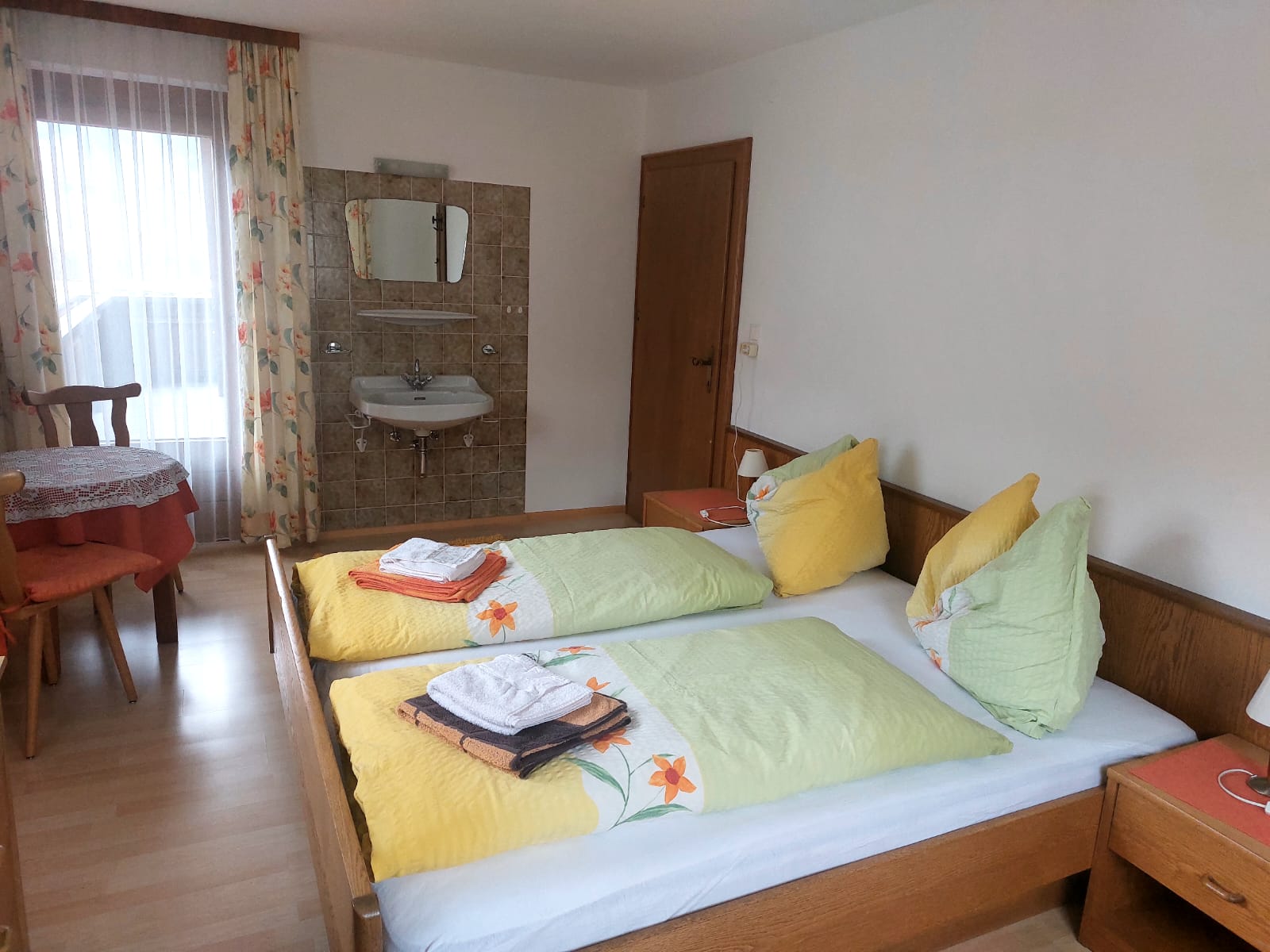 Room 1 with two beds made