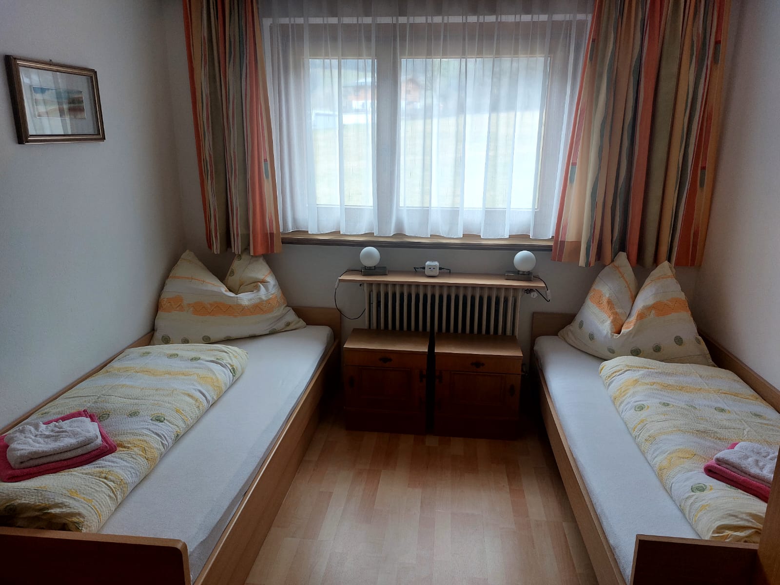 Room 3 with two beds and a sink