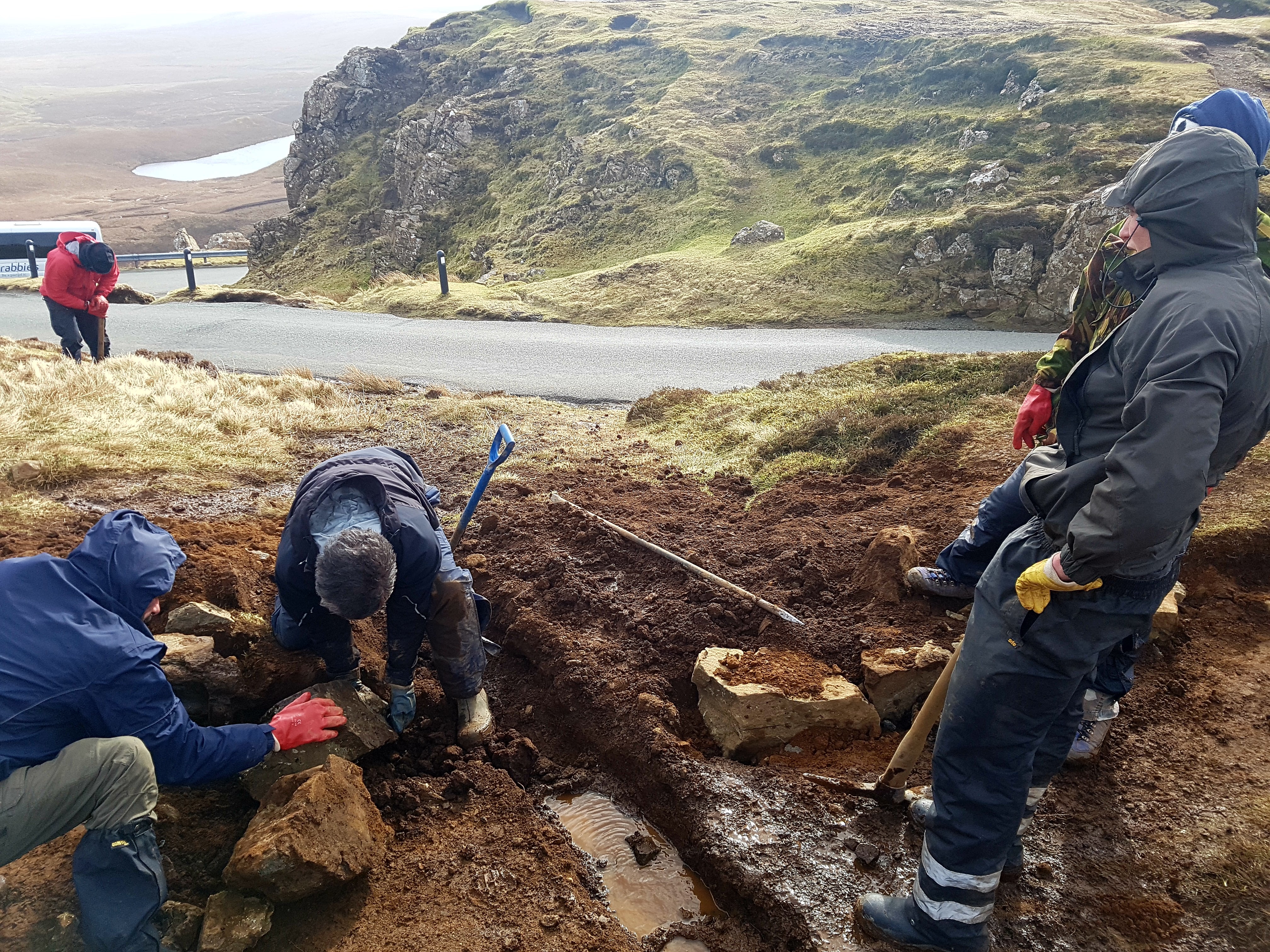 people building path in mud