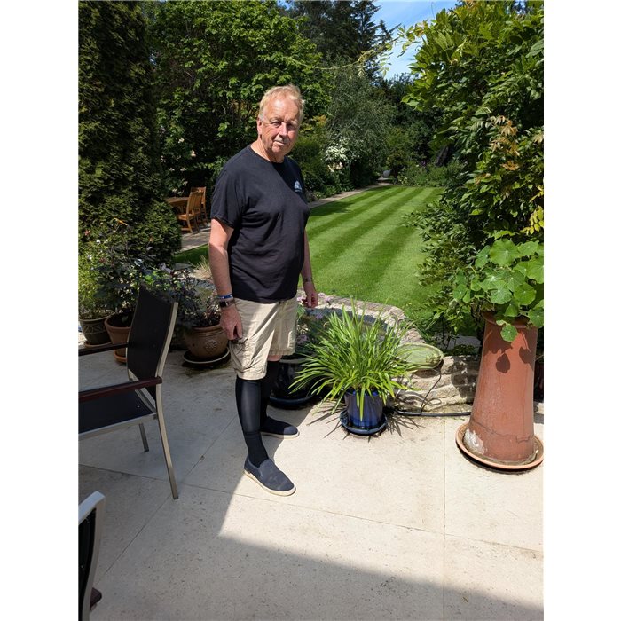 Fearghal on his patio in the sunshine