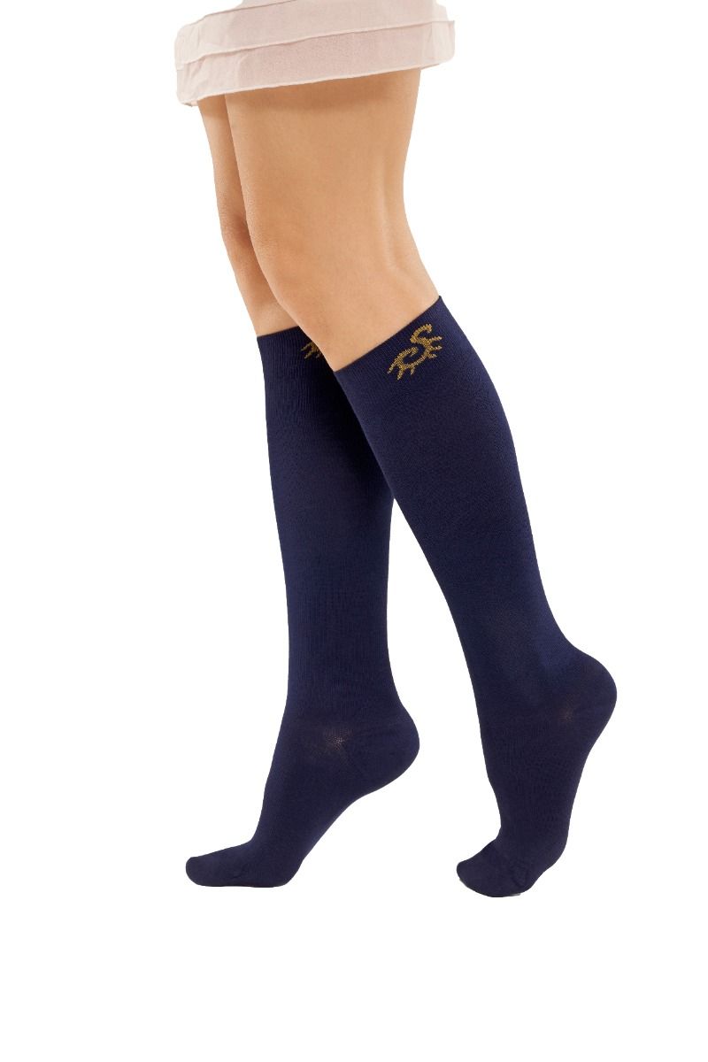 A pair of navy closed-toe knee-high compression socks in a bamboo knit, worn
