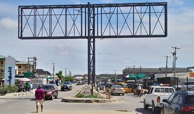Gantry-Billboard-At-Okota-Market-Ago-Palace-Lagos.jpg