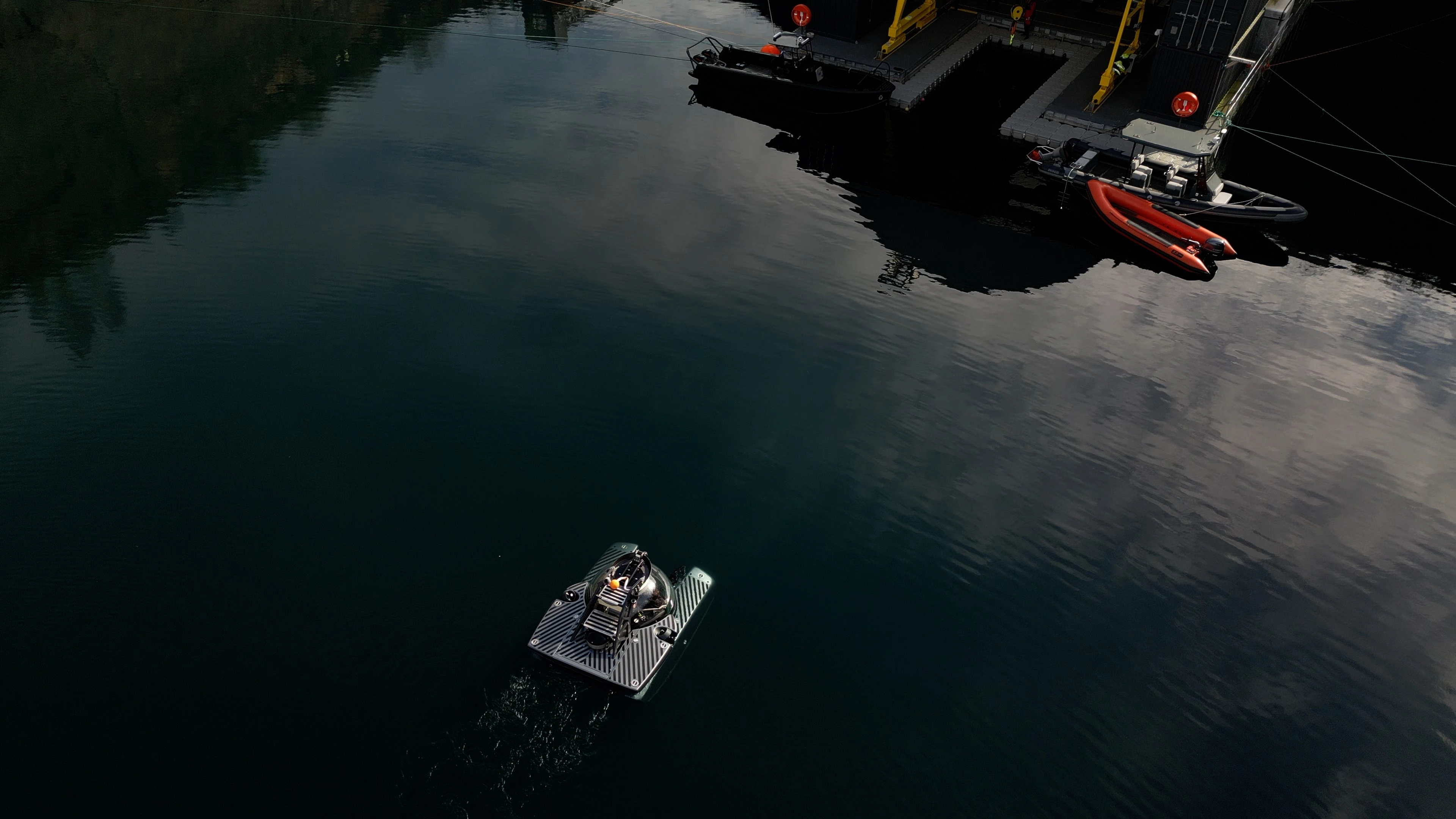Submersible emerging out of water in a lake