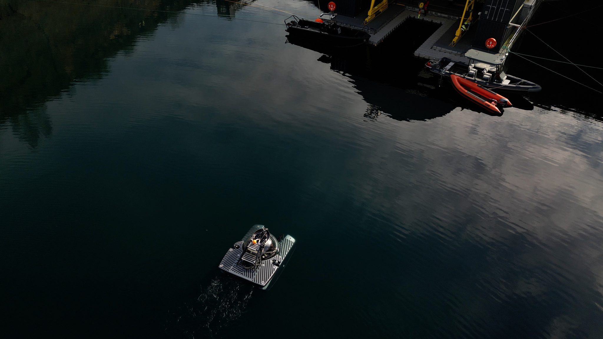 Submersible emerging out of water in a lake