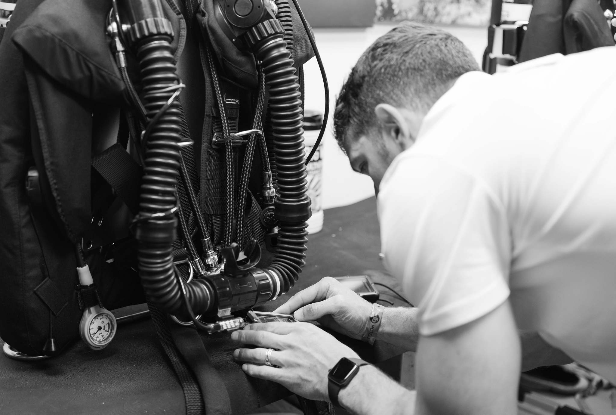 Person looking at closed circuit rebreather diving equipment