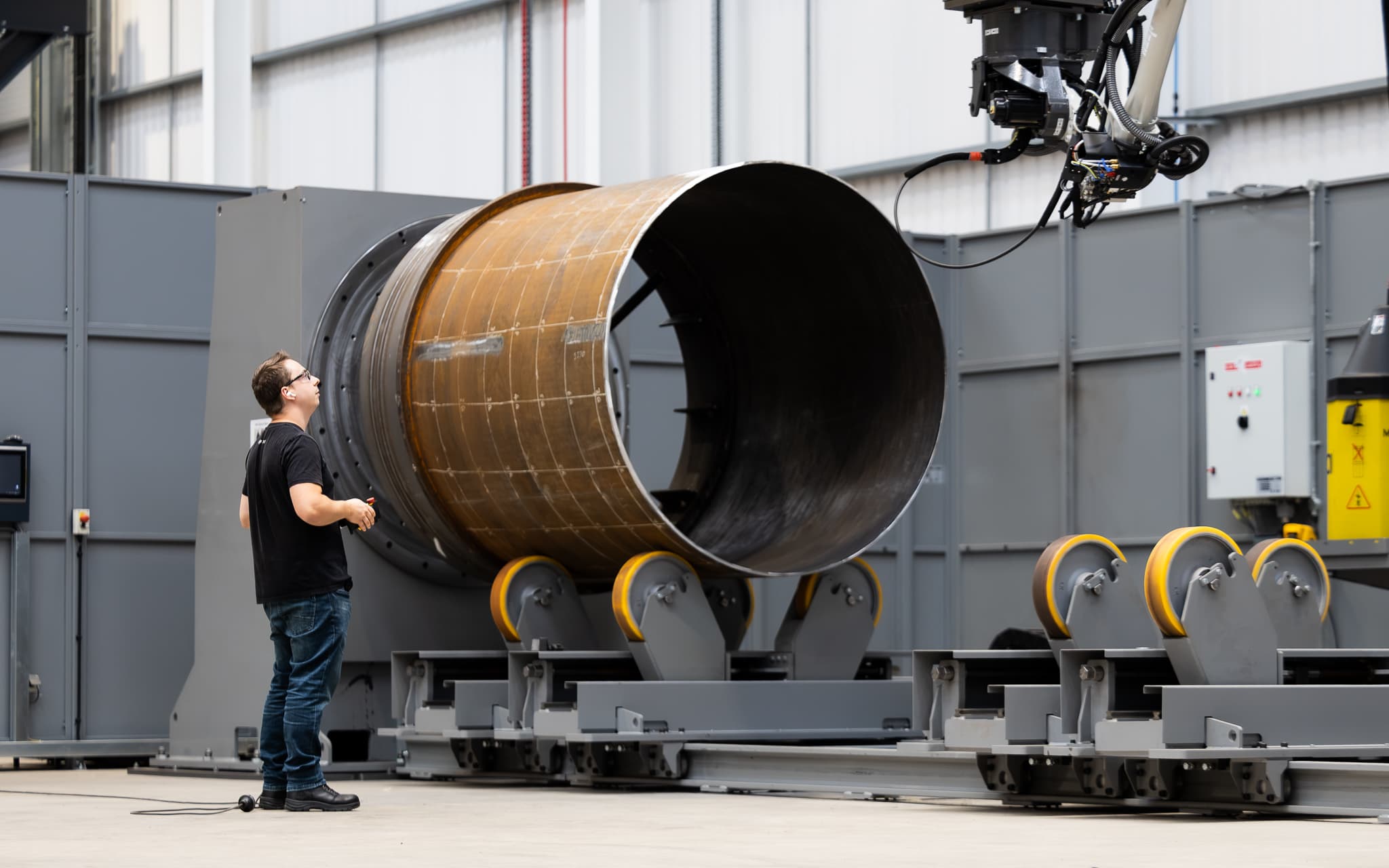 Large WAAM cylinder on a rotating manipulator at DEEP Manufacturing’s Bristol facility
